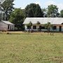 The whole terrain: the school-building with the kitchen and the new toilet-block.
